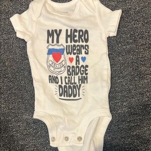 White Baby Onesie with Hero Badge Design